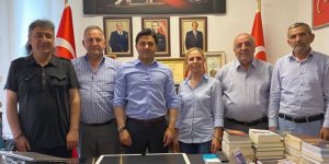 Başkan Adıgüzel, MHP Kars İl Genel Meclis Üyesi Turgay Uluhan'ı tebrik etti